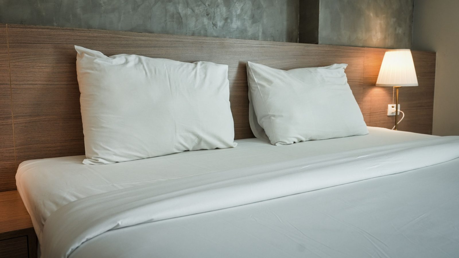 Clean vacation rental bedroom with neatly made bed